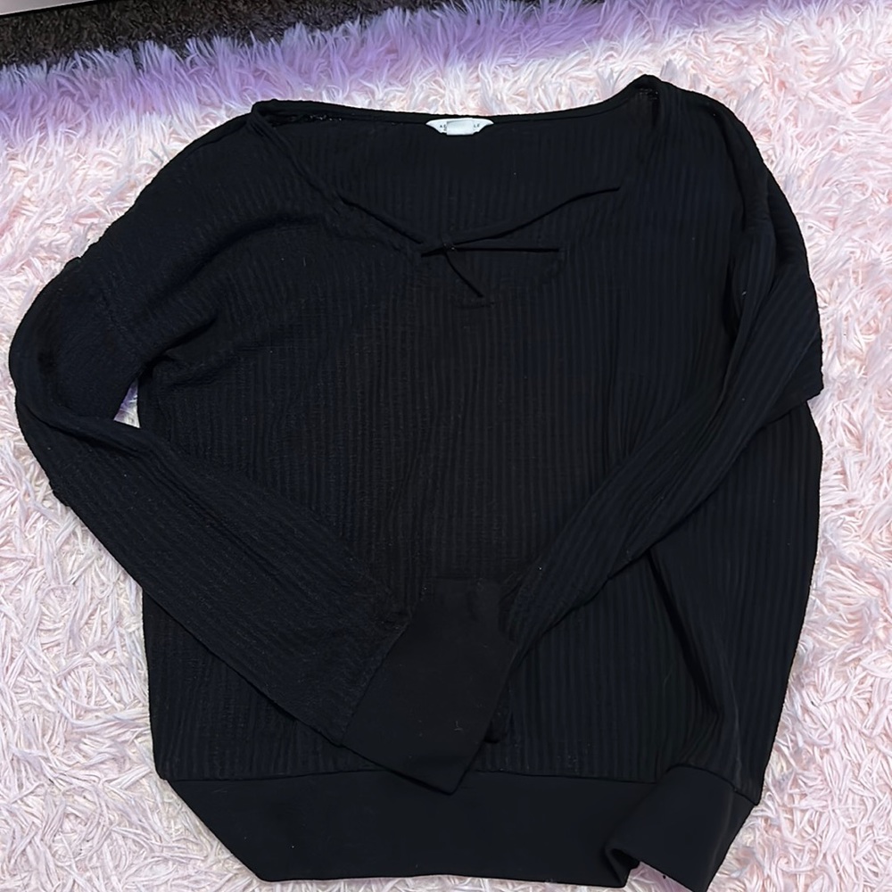 Long sleeve black top with cross in the front